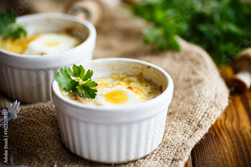 Baked egg with minced fish and mushrooms