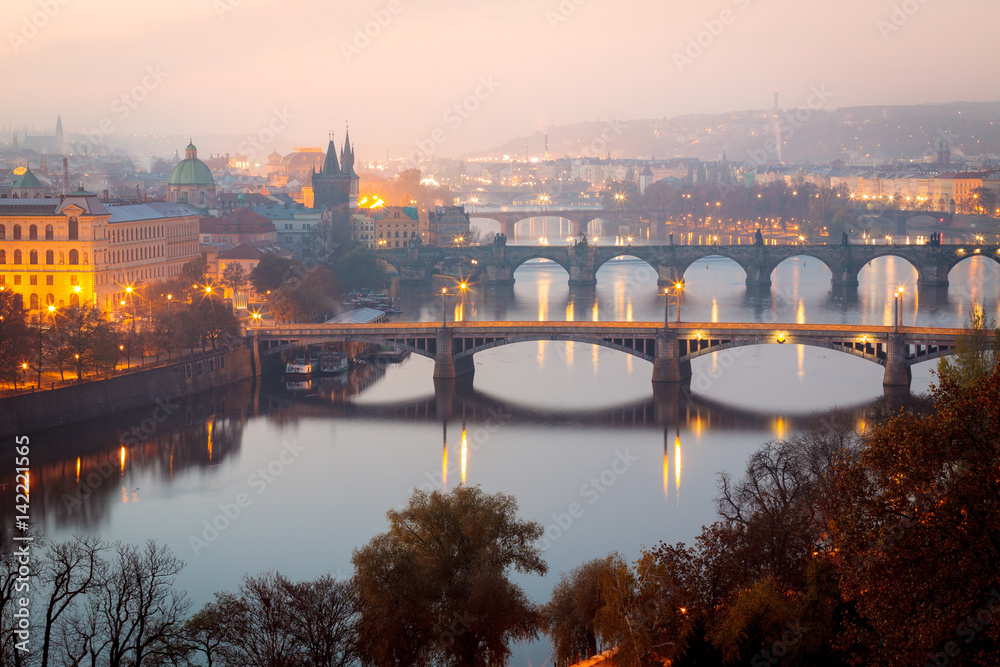 Morning view from above on Prague bridges, Charles Bridge on first plan.