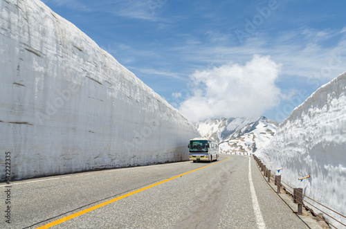 Blur windshield bus move along snow wall at japan alps tateyama kurobe alpine route photo