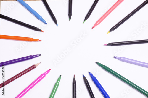 Diagonal fragment of opened colorful markers;