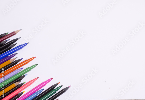 Diagonal fragment of opened colorful markers;