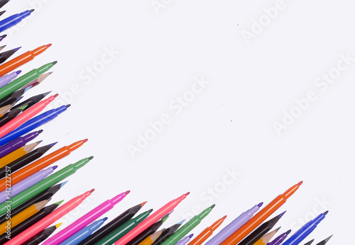Diagonal fragment of opened colorful markers;