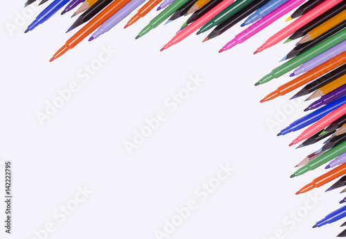 Diagonal fragment of opened colorful markers;