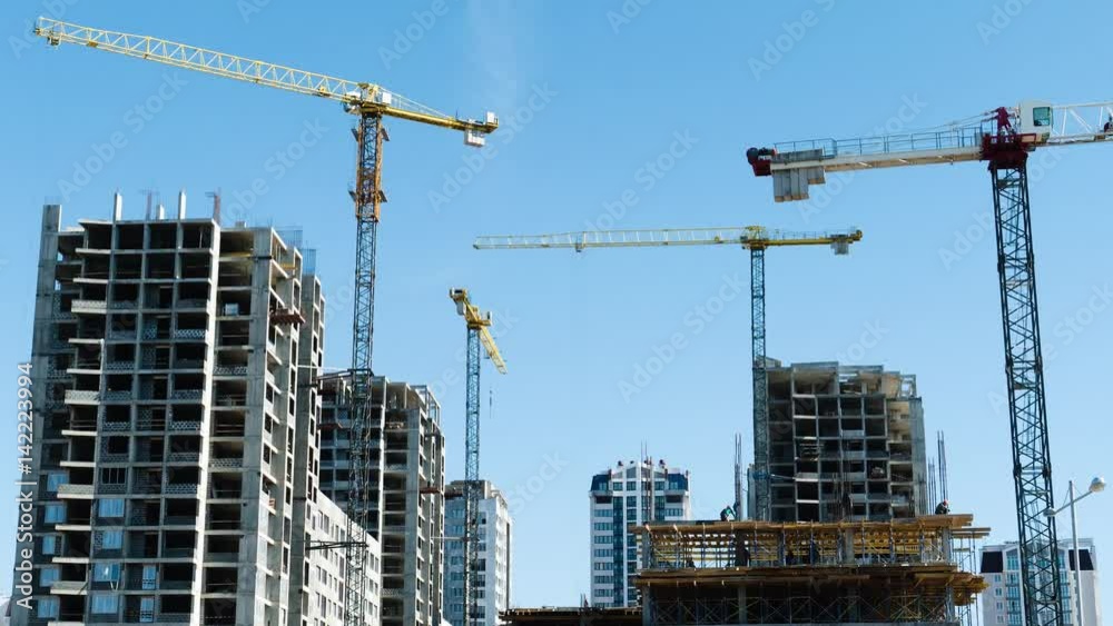 Building of residential buildings, timelapse, construction crane. 4k footage. 
