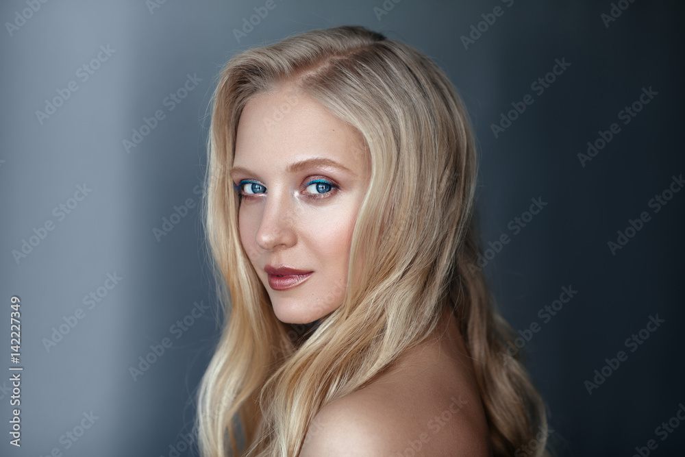 Beauty portrait of nordic natural blonde woman on dark background Beauty portrait of nordic natural blonde woman on dark background