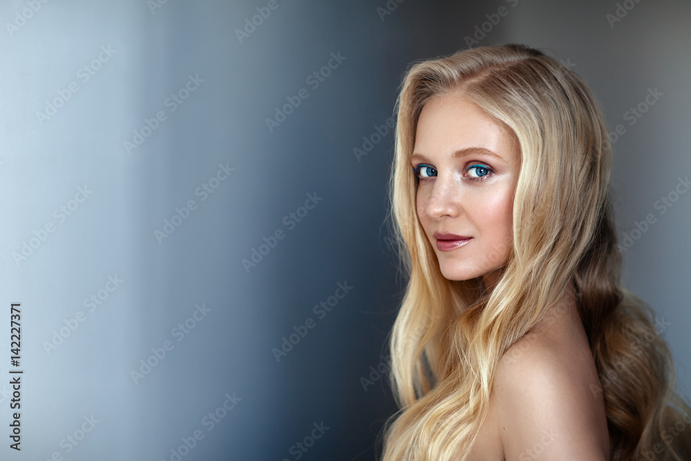 Beauty portrait of nordic natural blonde woman on dark background Beauty portrait of nordic natural blonde woman on dark background