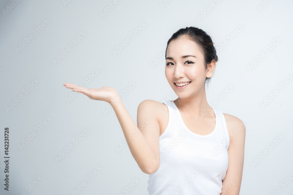 Asian young woman beautiful smile with posture present something in blank hand isolate on white background Asian young woman beautiful smile with posture present something in blank hand isolate on white background