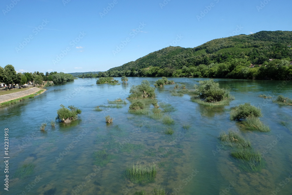 River Una on a summer day in Hrvatska Kostajnica, Croatia River Una on a summer day in Hrvatska Kostajnica, Croatia