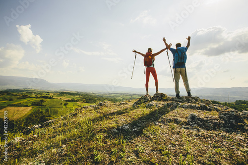 Young couple hiking on the mountain