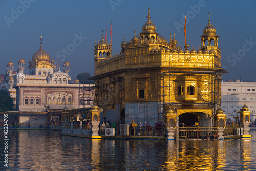 Wallpaper Mural The Golden Temple at Amritsar, Punjab, India, the most sacred icon and worship place of Sikh religion. Sunset light reflected on lake. Torontodigital.ca