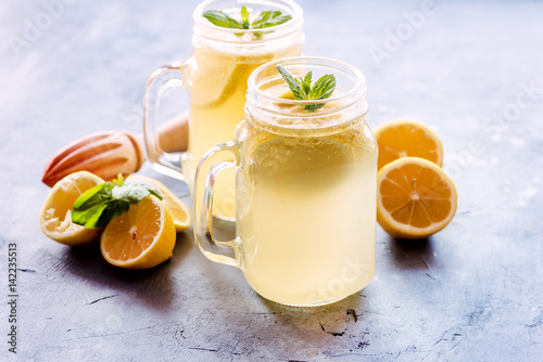Fresh lemonade in mug jar with ice and mint Horizontal photo