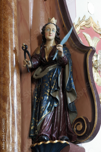 Saint Apollonia statue on the altar in Parish Church of Saint Martin in Martinska Ves, Croatia on June 03, 2011. photo