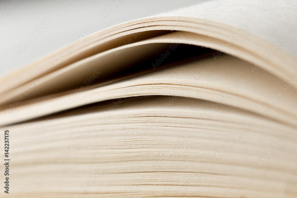 Education and wisdom concept - Macro view of book pages Education and wisdom concept - Macro view of book pages