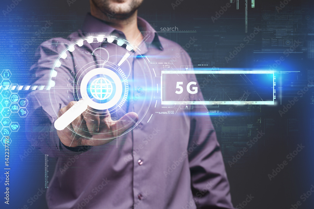 Business, Technology, Internet and network concept. Young businessman working on a virtual screen of the future and sees the inscription: 5G Business, Technology, Internet and network concept. Young businessman working on a virtual screen of the future and sees the inscription: 5G