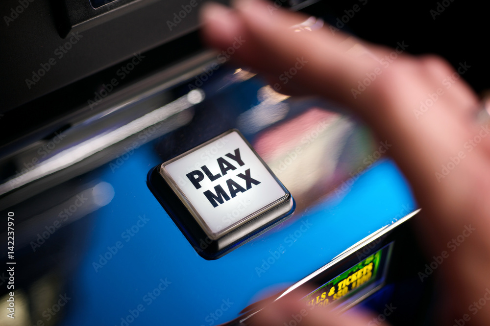 Tight Image of a Play max button on a slot machine.