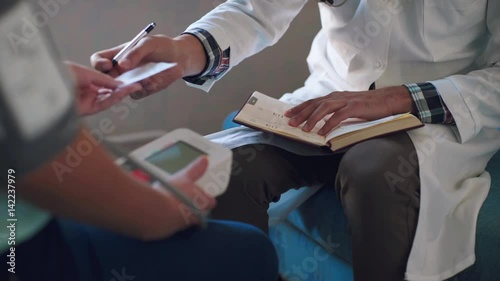 close up of patient and doctor prescribing medication