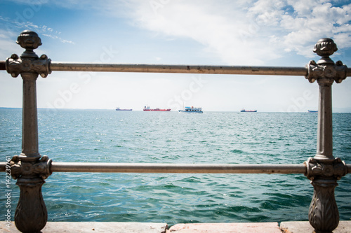 Obraz na płótnie Greece, Thessaloniki, about july 2015, Tankers in harbor, viewed through the bars w salonie