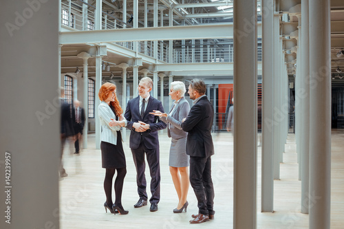 Принти на полотні People working together in corporation