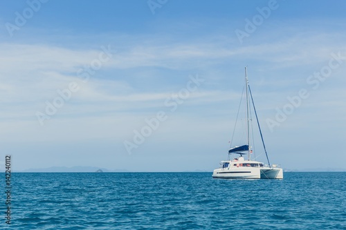 Summer travel adventure. Ocean explorer, yacht boat in the Andaman Sea. © Quality Stock Arts