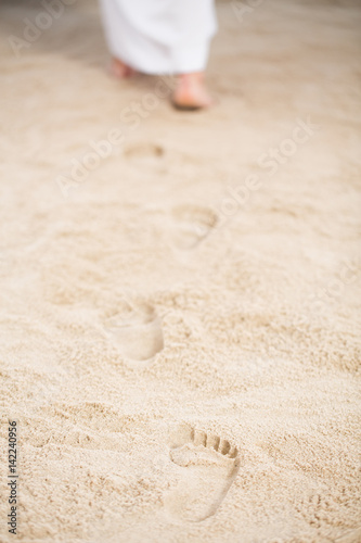 Jesus walking leaving footprints