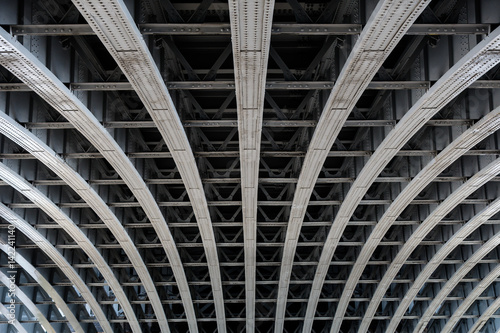 Parallel steel beams supporting bridge span