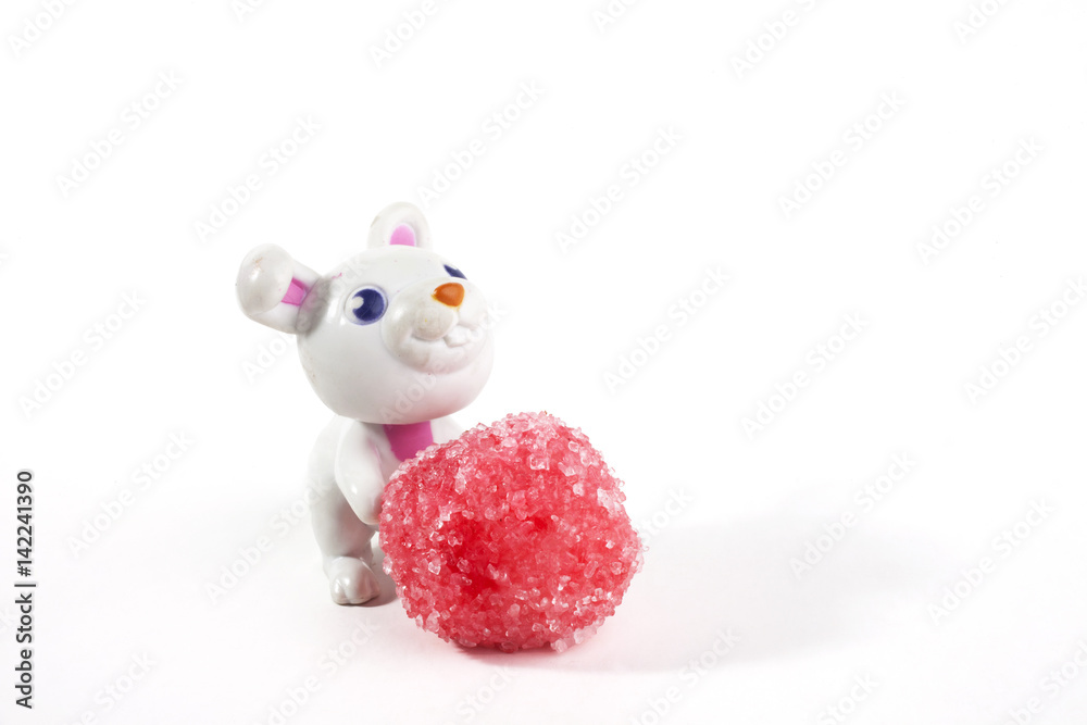 Obraz premium Bunny and candies together over a white background. Easter concept