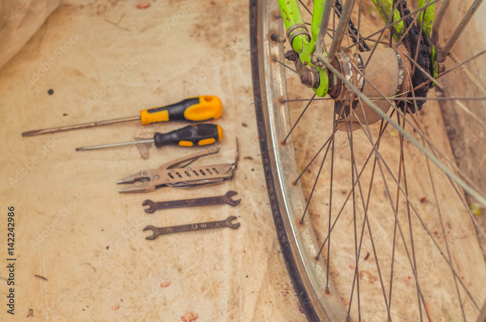 Screwdrivers and keys for repairing a bicycle wheel