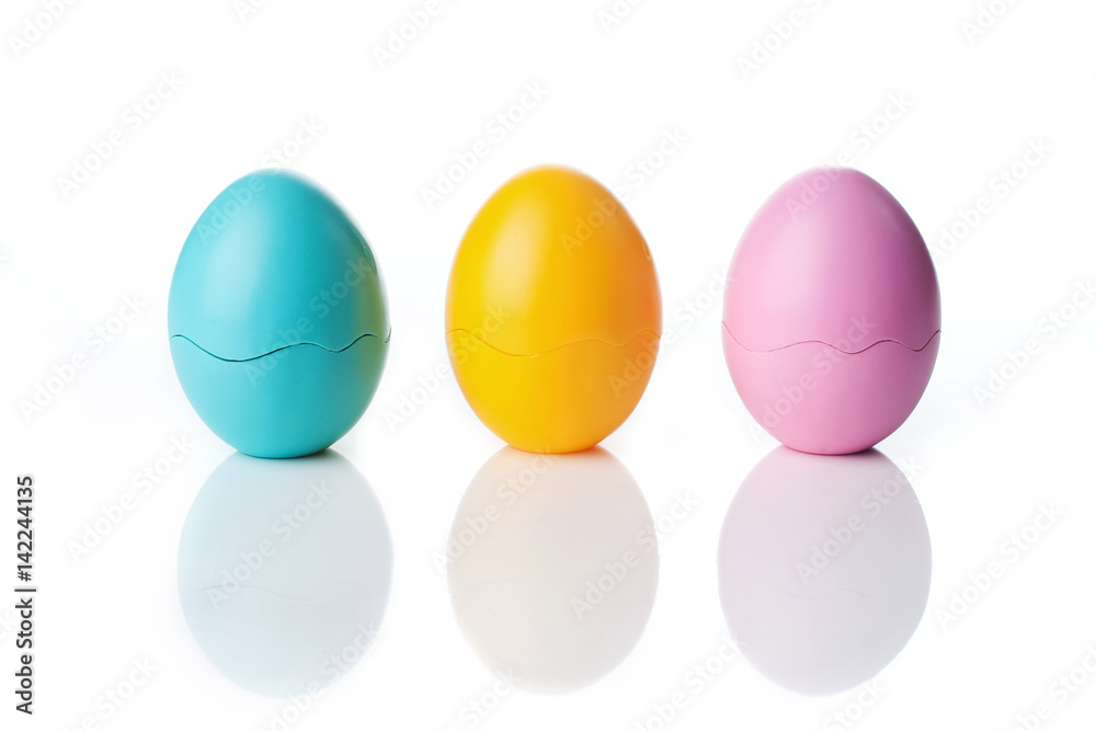 Colored Eggs over a white background