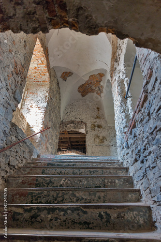 Abandoned medieval castle Saint Miklosh interior, Chinadievo, Western Ukraine. photo