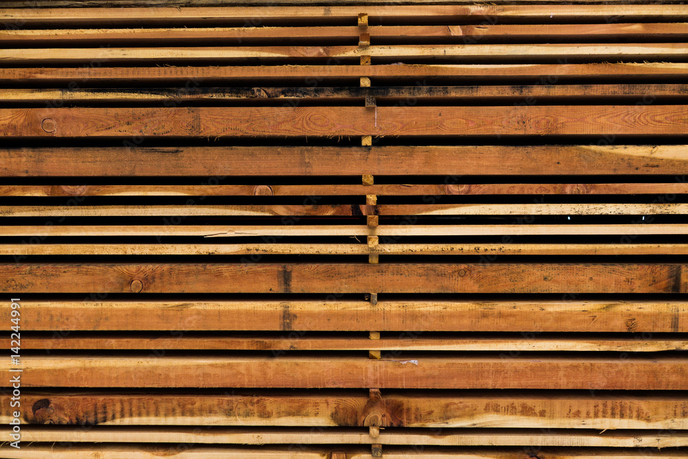 Stack of different size cut wood planks for construction Stack of different size cut wood planks for construction