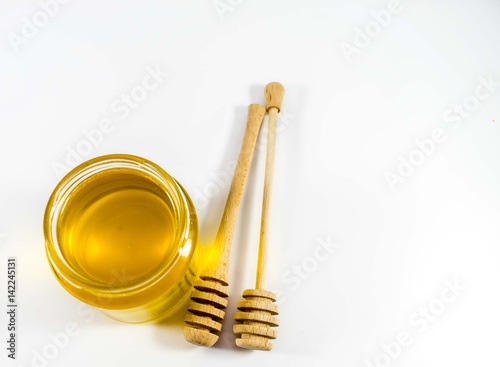 Honey jar and wooden stick