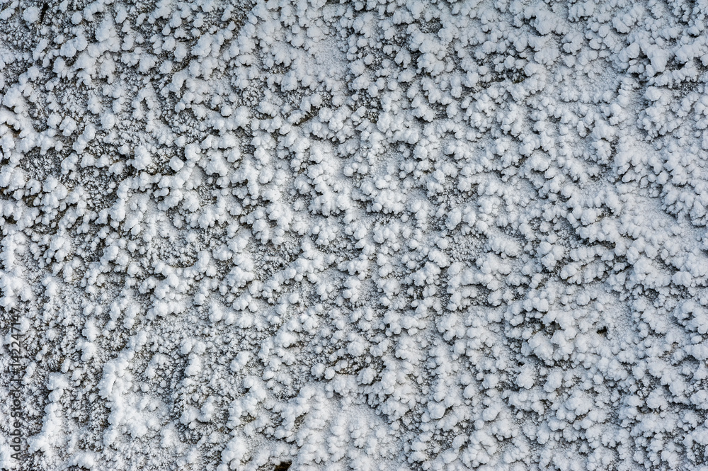 Surface hoar ice crystals formed on rockface in winter Surface hoar ice crystals formed on rockface in winter