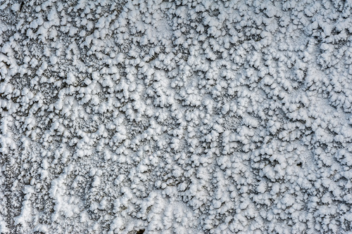 Surface hoar ice crystals formed on rockface in winter