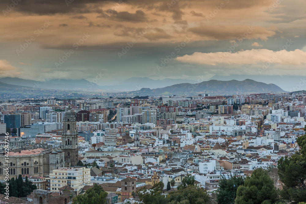 Rolling clouds over Malaga cityscape