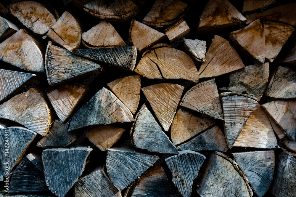 Firewood piled in stack outside Firewood piled in stack outside