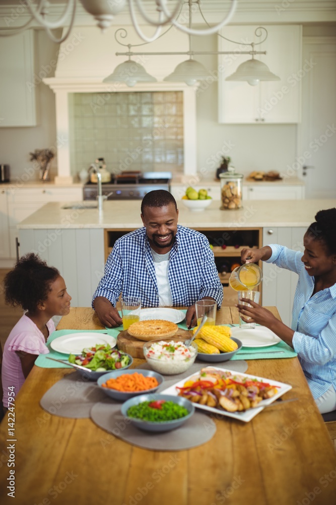 Family having meal on dinning table at home Family having meal on dinning table at home