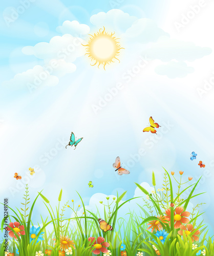 Summer background with green grass, flowers, butterflies and sky