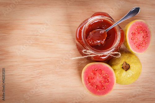 Brazilian dessert goiabada - jam of guava with fresh goiaba on wooden background. Selective focus. Copy space
