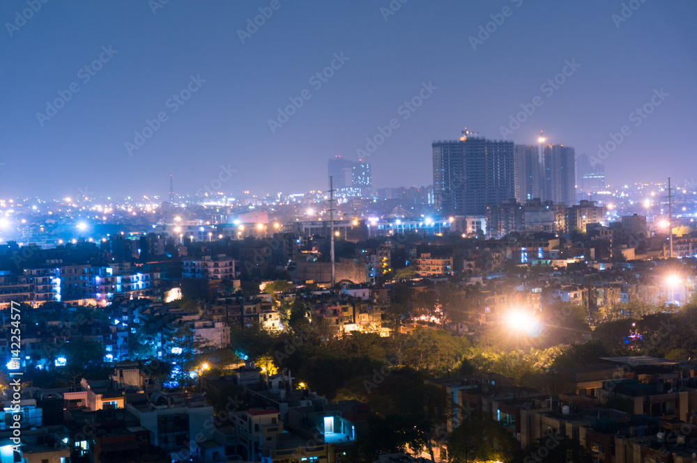 Fototapeta premium Cityscape of Noida Delhi at night with lights and under construction buildings