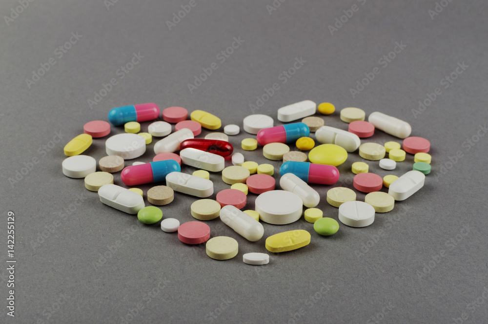 Heart created from colored pills. Medical concept Heart created from colored pills. Medical concept