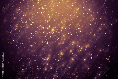 Golden abstract sparkles or glitter lights. Festive gold background. Defocused circles bokeh or particles. Template for design