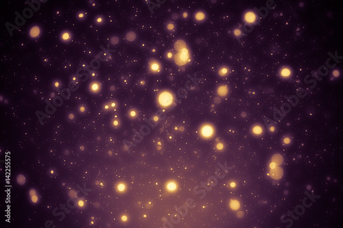 Golden abstract sparkles or glitter lights. Festive gold background. Defocused circles bokeh or particles. Template for design