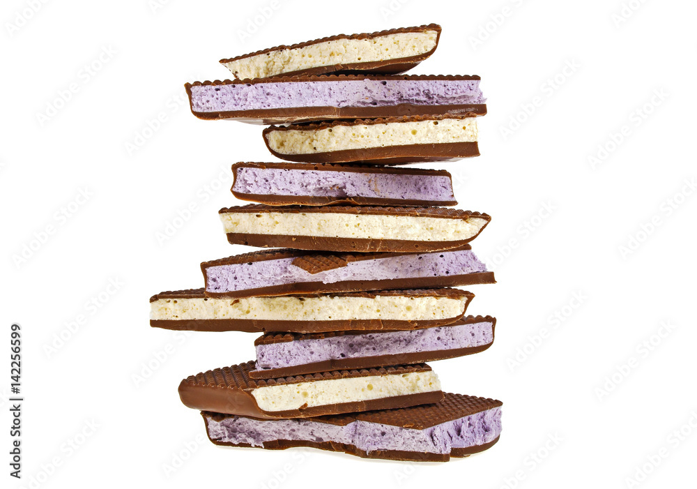 Fruit nougat in milk chocolate on a white background Fruit nougat in milk chocolate on a white background