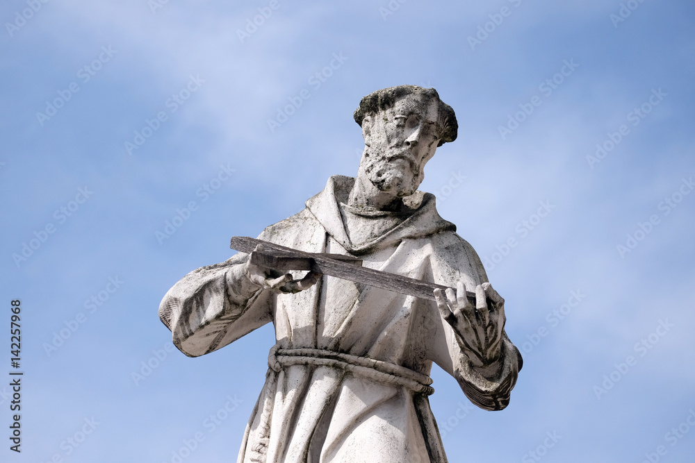 Saint Francis of Assissi statue, Plague column at Main Square of the city of Maribor in Slovenia, Europe. Historical religious sculpture.