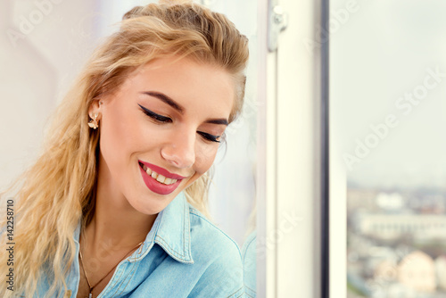 Blonde near the window enjoys life Free Download Blonde near the window enjoys life - GFXLoad
