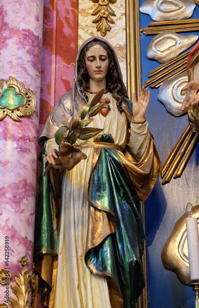 Immaculate Heart of Mary statue at the altar in the church of Saint Catherine of Alexandria in Krapina, Croatia.