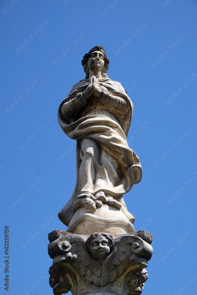 Statue of Virgin Mary on a column in front of the Church of St. Catherine of Alexandria in Krapina, Croatia