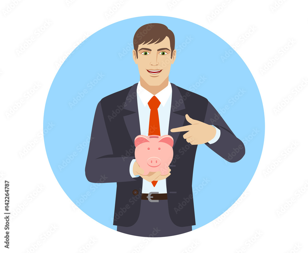 Businessman pointing at a piggy bank Businessman pointing at a piggy bank