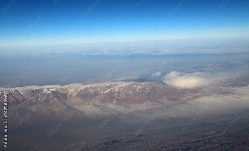 Mongolia aerial view of mountains covered with snow in the winter