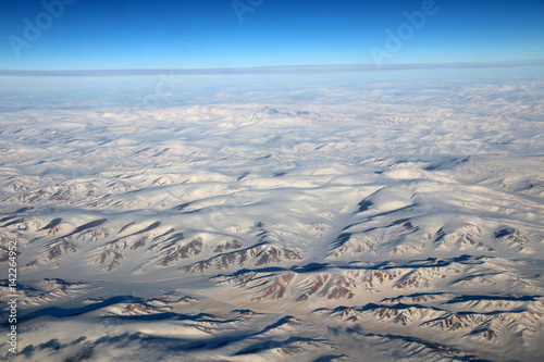Mongolia aerial view of mountains covered with snow in the winter